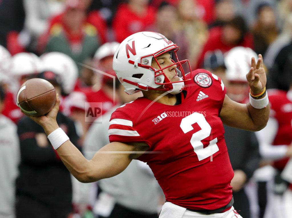 Nati Harnik FILE - In this Saturday, Sept. 29, 2018, file photo, Nebraska quarterback Adrian Martinez (2) throws a pass during the first half of an NCAA college football game against Purdue in Lincoln, Neb. Four starts into his career, Martinez already is showing signs of blossoming into the next standout quarterback coached by Scott Frost. (AP Photo/Nati Harnik, File)