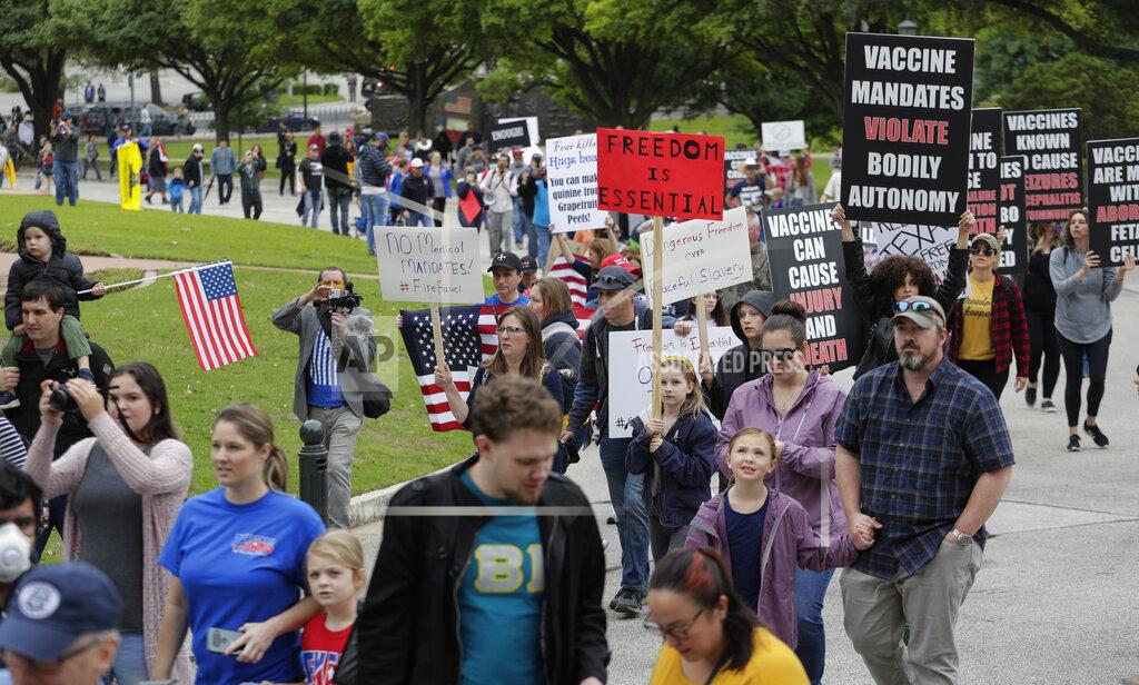 Eric Gay Protesters rally at the Texas State Capitol to speak out against Texas' handling of the COVID-19 outbreak, in Austin, Texas, Saturday, April 18, 2020. Austin and many other Texas cities remain under stay-at-home orders due to the COVID-19 outbreak except for essential personal. (AP Photo/Eric Gay)