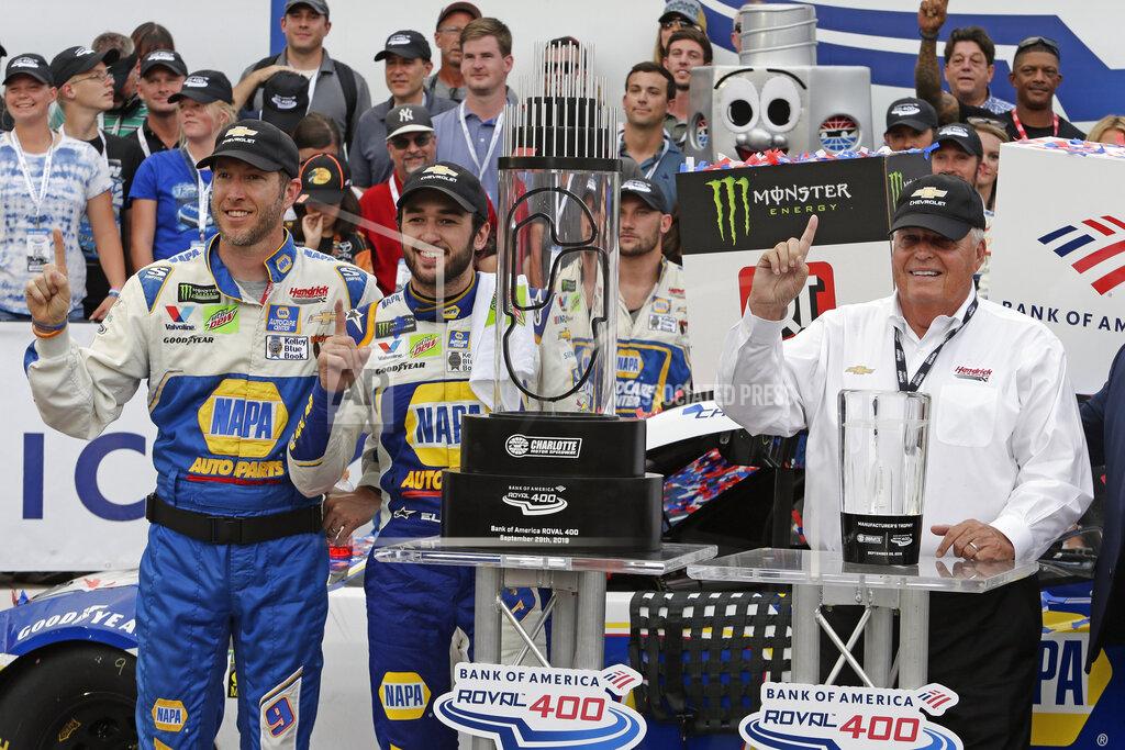 Wesley Broome Chase Elliott, center, car owner Rick Hendrick, right, and crew chief Alan Gustafson celebrate in victory lane after Elliot won the NASCAR Cup Series auto race at Charlotte Motor Speedway in Concord, N.C., Sunday, Sept. 29, 2019. (AP Photo/Wesley Broome)