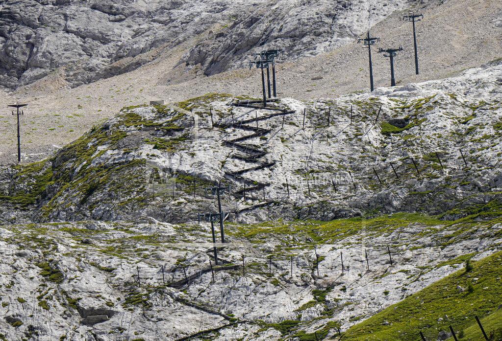Luca Bruno A view of the Punta Rocca near Canazei, in the Italian Alps in northern Italy, Tuesday, July 5, 2022, where a glacier broke loose on Sunday, sending an avalanche of tons of ice, snow, and rocks onto hikers. (AP Photo/Luca Bruno)