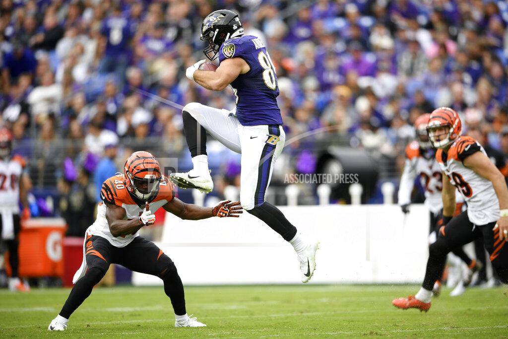 Nick Wass Baltimore Ravens tight end Mark Andrews, right, begins to leap over Cincinnati Bengals defensive back Brandon Wilson (40) during the first half of a NFL football game Sunday, Oct. 13, 2019, in Baltimore. Andrews fumbled the ball and the Bengals recovered. (AP Photo/Nick Wass)