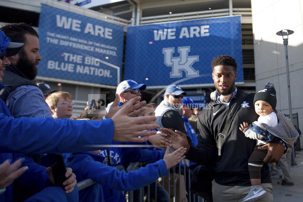 Bryan Woolston Kentucky linebacker Josh Allen (41) and his son Wesley greet fans during a pep rally before an NCAA college football game against Vanderbilt in Lexington, Ky., Saturday, Oct. 20, 2018. (AP Photo/Bryan Woolston)