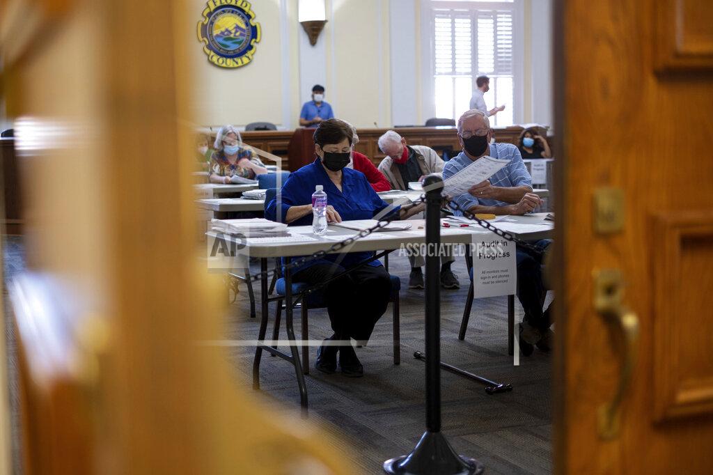 Ben Gray Officials sort ballots during an audit at the Floyd County administration building in Rome, Ga. on Friday morning, Nov. 13, 2020. Election officials in Georgia’s 159 counties are undertaking a hand tally of the presidential race that stems from an audit required by state law. (AP Photo/Ben Gray)