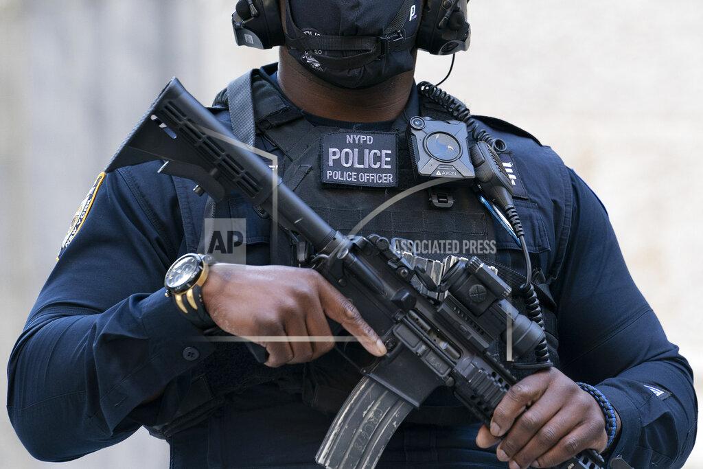 Mark Lennihan FILE - In this Oct. 5, 2020, file photo, a New York Police Department's counterterrorism officer stands outside St. Patrick's Cathedral wearing a body camera in New York. Portland, Ore., which has become the epicenter of racial justice protests, is one of the few major U.S. cities where police do not have body cameras. City leaders and police have advocated for the use of body cameras which proponents say promote accountability. But officials say the department does not have the funds, following the mayor and City Council's decision to cut millions of dollars from the police bureau's budget in 2020. (AP Photo/Mark Lennihan, File)
