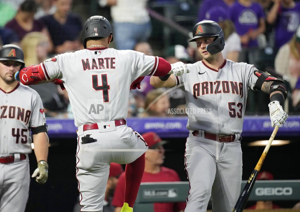 David Zalubowski Arizona Diamondbacks' Ketel Marte (4) celebrates his solo home run with Christian Walker (53) during the sixth inning of a baseball game against the Colorado Rockies, Saturday, July 2, 2022, in Denver. (AP Photo/David Zalubowski)