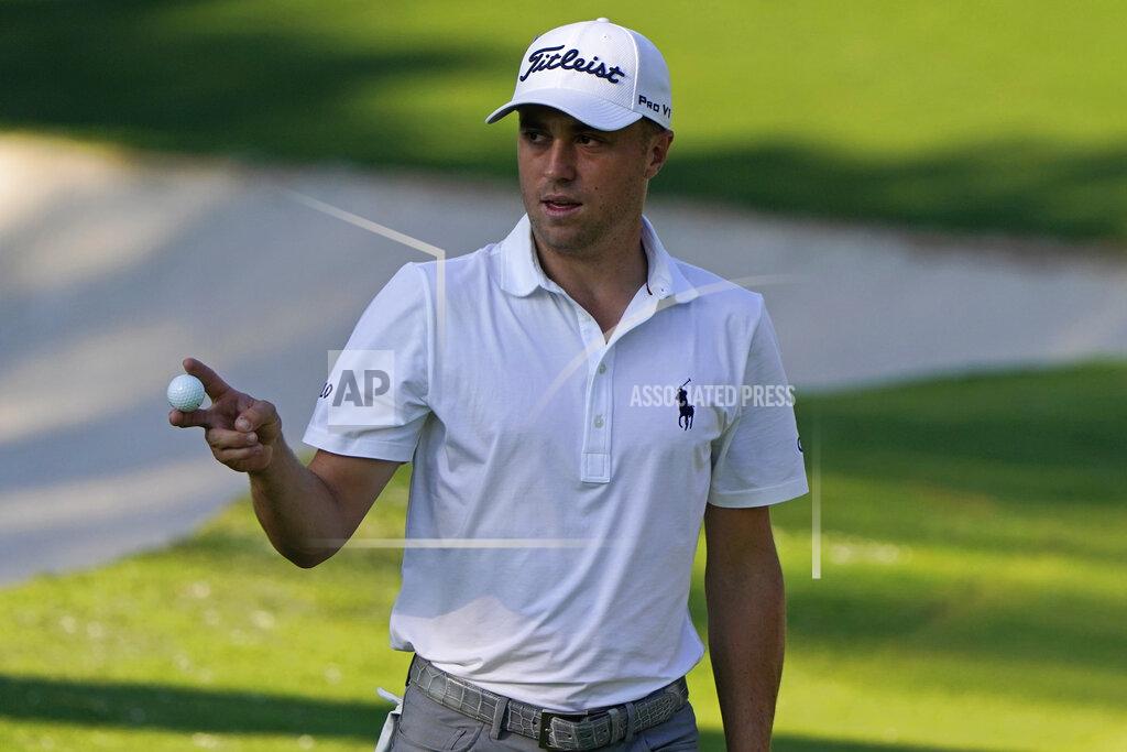 Chris Carlson Justin Thomas waves ball after a birdie on the 10th hole during the third round of the Masters golf tournament Saturday, Nov. 14, 2020, in Augusta, Ga. (AP Photo/Chris Carlson)