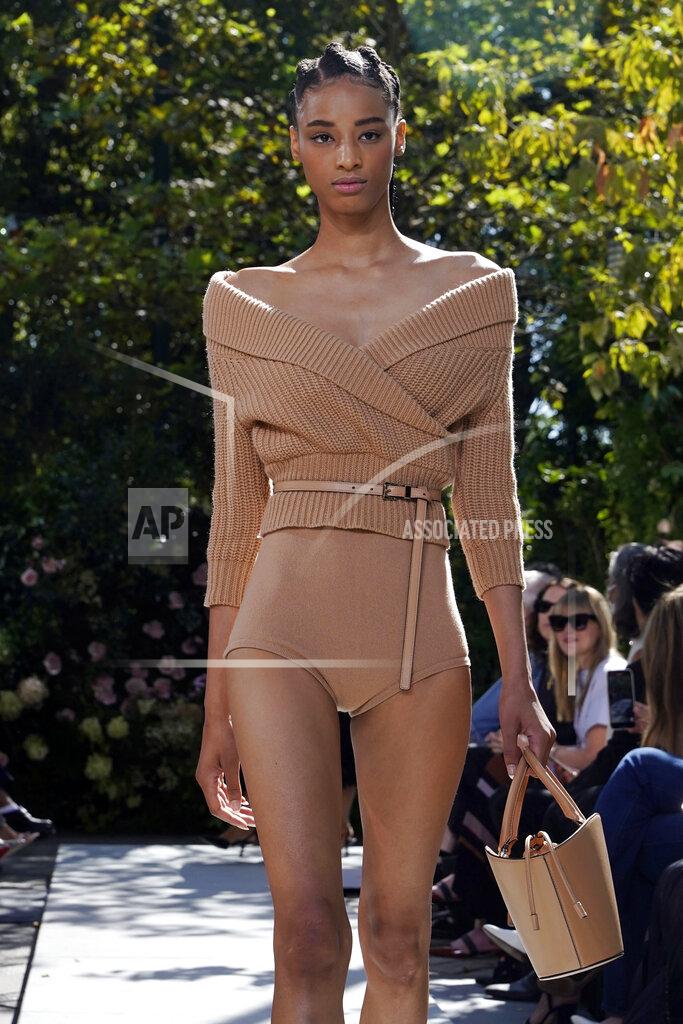 Richard Drew The Michael Kors Spring/Summer 2022 collection is modeled during Fashion Week in New York, Friday, Sept. 10, 2021. (AP Photo/Richard Drew)