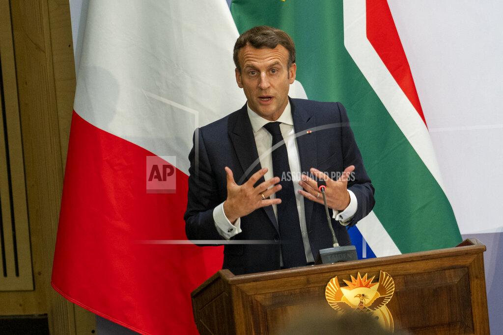 Jerome Delay French President Emmanuel Macron delivers a speech at the University of Pretoria Future Africa in Pretoria, South Africa, Friday May 28, 2021. Macron and South African President Cyril Ramaphosa are launching a program to support African vaccine production, a project backed by the European Union, the United States and the World Bank. (AP Photo/Jerome Delay)