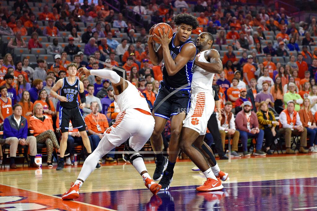 Richard Shiro Duke's Vernon Carey Jr., center, works while defended by Clemson's Clyde Trapp, left, and Aamir Simms during the first half of an NCAA college basketball game Tuesday, Jan. 14, 2020, in Clemson, S.C. (AP Photo/Richard Shiro)