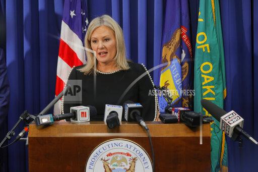 Oakland County prosecutor Karen McDonald addresses the media in her office, Friday, Dec. 3, 2021, in Pontiac, Mich. McDonald filed involuntary manslaughter charges against Jennifer and James Crumbley, the parents of 15-year-old Ethan Crumbley, who is accused of killing four students at a Michigan high school. (Eric Seals /Detroit Free Press via AP)