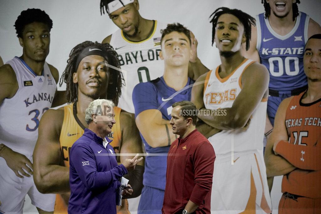 Charlie Riedel Kansas State coach Bruce Weber, left, and Iowa State coach T.J. Otzelberger talk during Big 12 NCAA college basketball media day Wednesday, Oct. 20, 2021, in Kansas City, Mo. (AP Photo/Charlie Riedel)