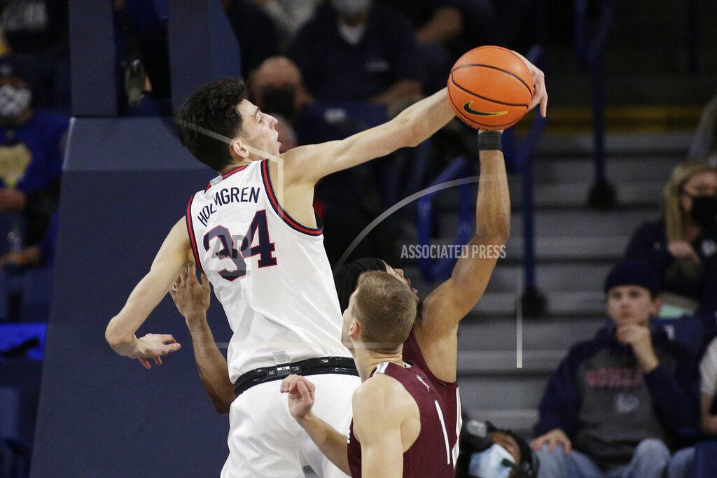 Young Kwak Gonzaga center Chet Holmgren, left, blocks a shot by Bellarmine guard Dylan Penn during the second half of an NCAA college basketball game, Friday, Nov. 19, 2021, in Spokane, Wash. Gonzaga won 92-50. (AP Photo/Young Kwak)