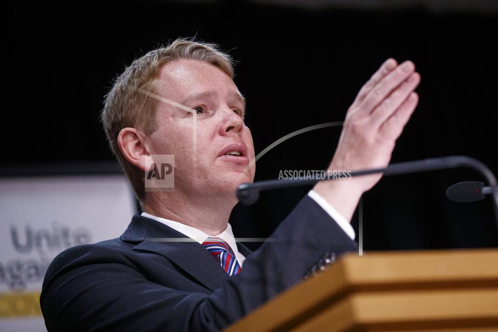 Robert Kitchin New Zealand's COVID-19 Response Minister Chris Hipkins gestures during a press conference in Wellington, New Zealand, Thursday, Oct. 28, 2021. Hipkins said that from next month, most people arriving in New Zealand would need to spend seven days in a quarantine hotel run by the military, half the previous requirement. (Robert Kitchin/Pool Photo via AP)
