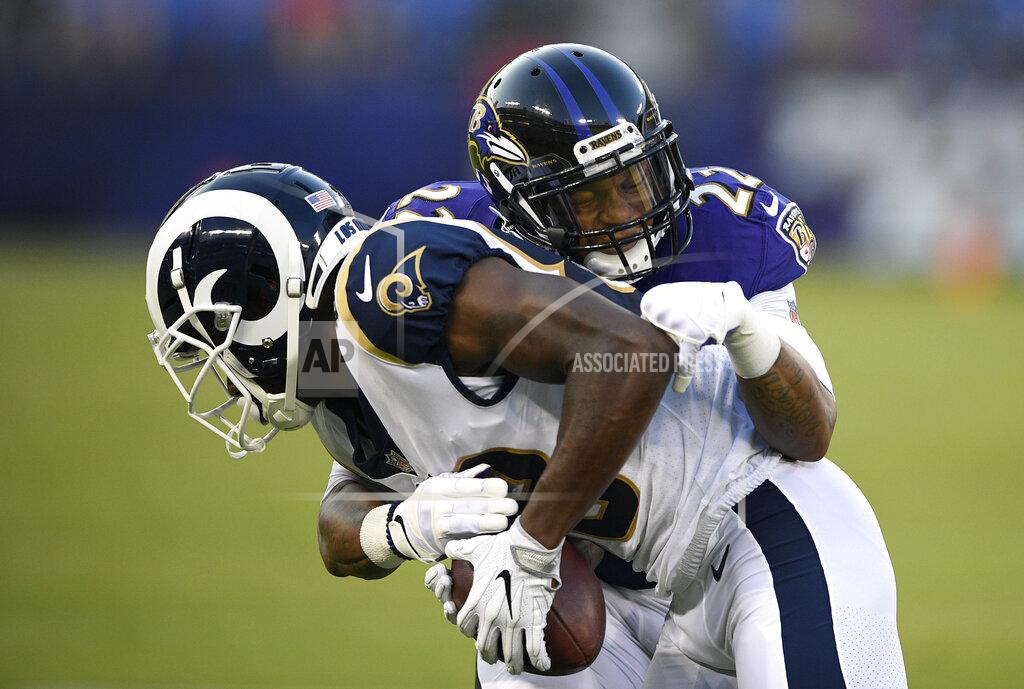 FILE - In this Aug. 9, 2018, file photo, Baltimore Ravens defensive back Jimmy Smith (22) tackles Los Angeles Rams wide receiver Mike Thomas in the first half of a preseason NFL football game, in Baltimore. Back in action after yet another injury, Ravens cornerback Jimmy Smith hopes to be an integral part of the Baltimore defense over the final half of the season. (AP Photo/Nick Wass, File)