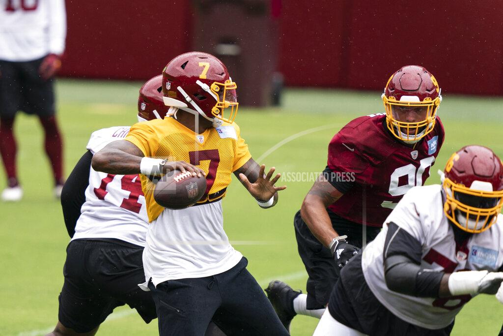 Alex Brandon Washington quarterback Dwayne Haskins Jr. (7) looks to pass with defensive end Montez Sweat (90) nearby during an NFL football practice at FedEx Field, Monday, Aug. 31, 2020, in Washington. (AP Photo/Alex Brandon)