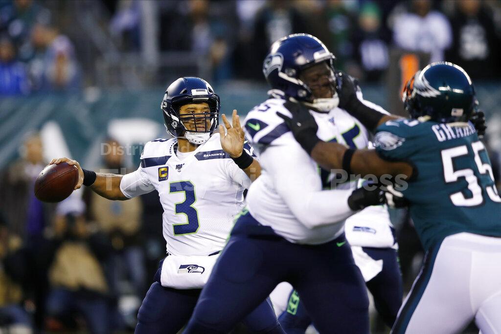 Seattle Seahawks' Russell Wilson passes during the first half of an NFL wild-card playoff football game against the Philadelphia Eagles, Sunday, Jan. 5, 2020, in Philadelphia. (AP Photo/Matt Rourke)