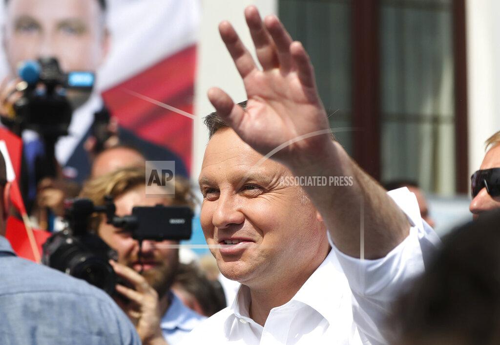Czarek Sokolowski Polish President Andrzej Duda waves to supporters as he campaigns for a second term in Serock, Poland, on Wednesday, June 17, 2020, Duda is the frontrunner ahead of the election on Sunday, June 28, but is not expected to reach the 50% threshold needed to win outright. That will require a runoff two weeks later in which he is expected to face off against Warsaw Mayor Rafal Trzaskowski in a very close race.(AP Photo/Czarek Sokolowski)