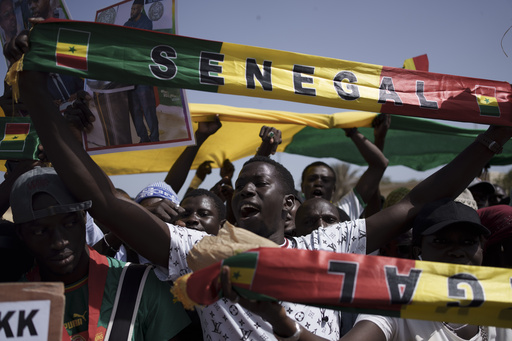 FILE - People shout slogans during a protest against the possibility of President Macky Sall to run for a third term in the presidential elections next year in Dakar, Senegal, Friday, May 12, 2023. West Africa's regional bloc has urged authorities in Senegal to restore the nation&rsquo;s electoral calendar after its presidential election was delayed. The bloc made the call on Monday just as the United Nations human rights office expressed concerns about the unprecedented decision in one of Africa&rsquo;s most stable democracies. (AP Photo/Leo Correa, File)