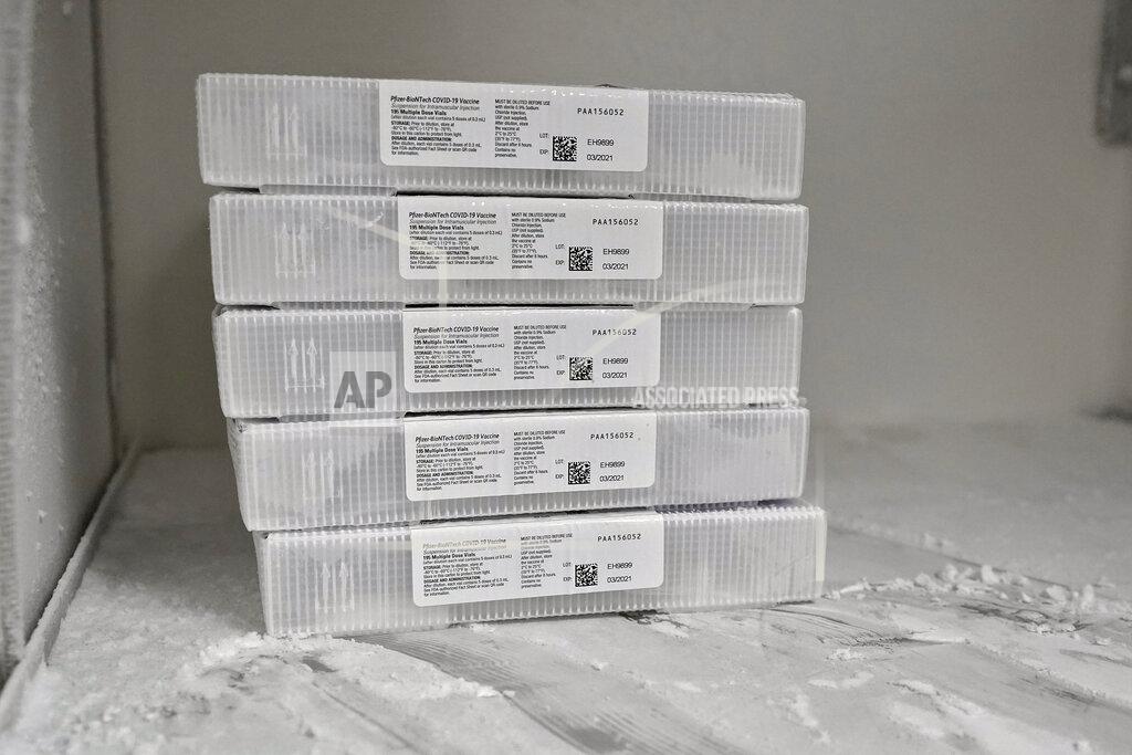 The Pfizer-BioNTech COVID-19 vaccine is seen in a freezer after being delivered Monday, Dec. 14, 2020, at the Tampa General Hospital in Tampa, Fla. (AP Photo/Chris O'Meara)