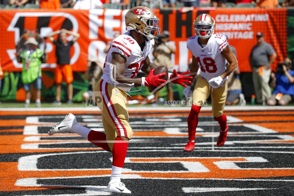 Frank Victores San Francisco 49ers running back Jeffrey Wilson runs in a touchdown during the first half an NFL football game against the Cincinnati Bengals, Sunday, Sept. 15, 2019, in Cincinnati. (AP Photo/Frank Victores)