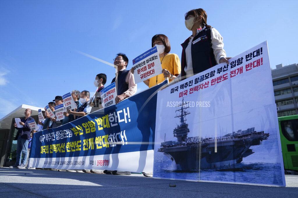 Ahn Young-Joon Protesters stage a rally to oppose the planned the joint military exercises between the U.S. and South Korea in front of the U.S. Embassy in Seoul, South Korea, Thursday, Sept. 22, 2022. The nuclear-powered aircraft carrier USS Ronald Reagan arrived in the South Korean port of Busan on Friday ahead of the two countries' joint military exercise that aims to show their strength against growing North Korean threats. The signs read: "We oppose arrival of the nuclear-powered aircraft carrier USS Ronald Reagan." (AP Photo/Ahn Young-joon)