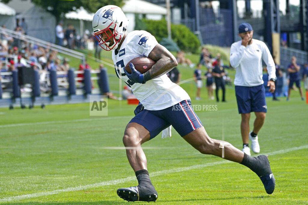 New England Patriots wide receiver N'Keal Harry (15) runs after catching a pass during an NFL football practice, Friday, July 30, 2021, in Foxborough, Mass. (AP Photo/Elise Amendola)
