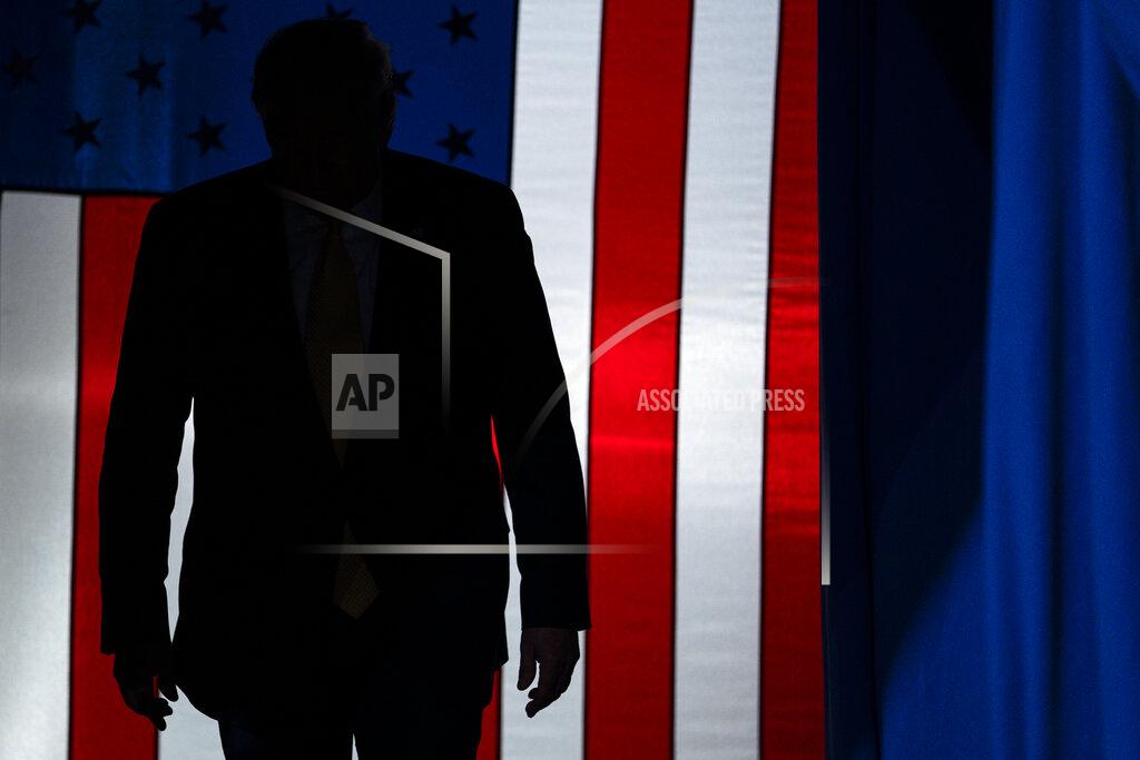 FILE - In this Feb. 20, 2020, file photo President Donald Trump arrives to speak at a campaign rally at The Broadmoor World Arena in Colorado Springs, Colo. As the economy faces a once-in-a-century recession, with more than 38 million people out of work, Trump is increasingly talking up a future recovery that probably won't materialize until after the November election. (AP Photo/Evan Vucci, File)