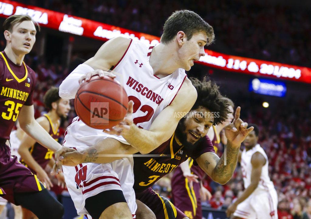 Andy Manis Minnesota's Jordan Murphy (3) reaches in on Wisconsin's Ethan Happ (22) during the second half of an NCAA college basketball game Thursday, Jan. 3, 2019, in Madison, Wis. Minnesota won 59-52. (AP Photo/Andy Manis)