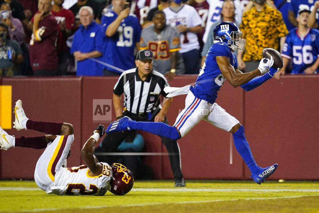 Patrick Semansky New York Giants wide receiver Darius Slayton (86) makes a touchdown catch against Washington Football Team cornerback William Jackson (23) during the second half of an NFL football game, Thursday, Sept. 16, 2021, in Landover, Md. (AP Photo/Patrick Semansky)