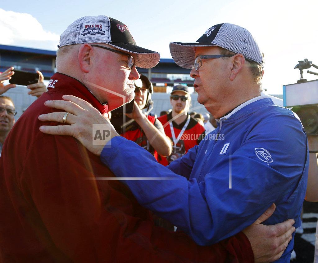 Rogelio V. Solis Duke head coach David Cutcliffe, right, confers with Temple interim head coach Ed Foley, left, following the Independence Bowl NCAA college football game in Shreveport, La., Thursday, Dec. 27, 2018. (AP Photo/Rogelio V. Solis)