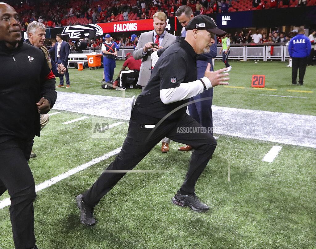 Curtis Compton Atlanta Falcons head coach Dan Quinn dashes off the field with a 24-12 victory over the Jacksonville Jaguars during the final home game of the season in a NFL football game on Sunday, December 22, 2019, in Atlanta. (Curtis Compton/Atlanta Journal-Constitution via AP)