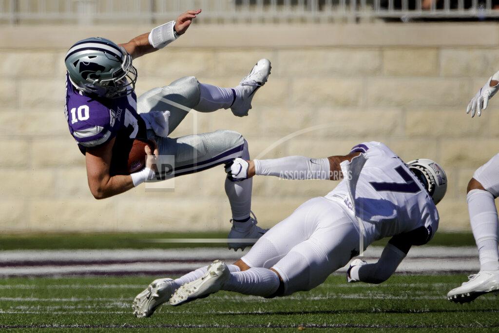 Charlie Riedel Kansas State quarterback Skylar Thompson (10) is tackled by TCU safety Trevon Moehrig (7) as he runs for a first down during the first half of an NCAA college football game Saturday, Oct. 19, 2019, in Manhattan, Kan. (AP Photo/Charlie Riedel)