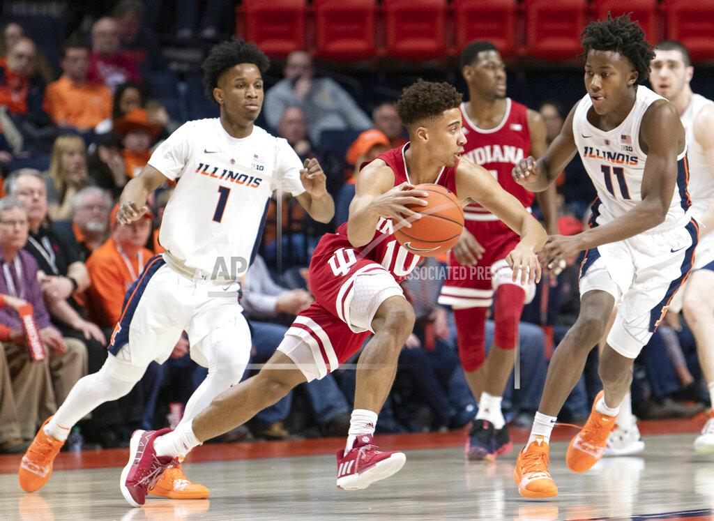 Stephen Haas Indiana guard Rob Phinisee (10) moves the ball as Illinois guards Ayo Dosunmu (11) and Trent Frazier (1) defend during the first half of an NCAA college basketball game in Champaign, Ill., Thursday, March 7, 2019. (AP Photo/Stephen Haas)