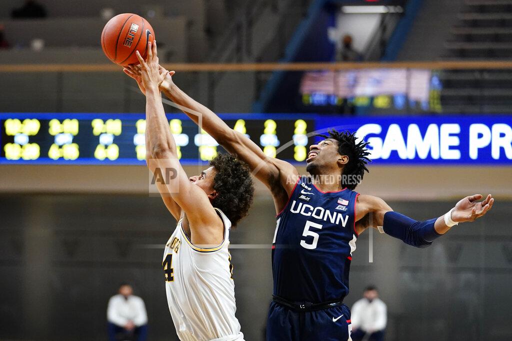 Matt Slocum Connecticut's Isaiah Whaley, right, and Villanova's Jeremiah Robinson-Earl leap for a rebound during the second half of an NCAA college basketball game, Saturday, Feb. 20, 2021, in Villanova, Pa. (AP Photo/Matt Slocum)