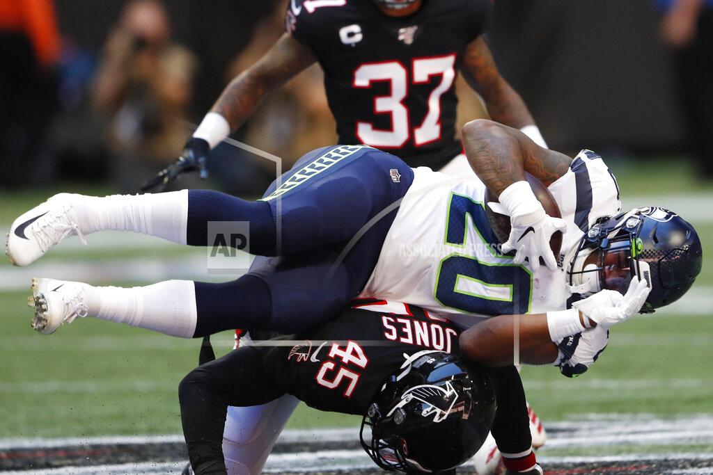 John Bazemore Seattle Seahawks running back Rashaad Penny (20) is hit by Atlanta Falcons linebacker Deion Jones (45) during the first half of an NFL football game, Sunday, Oct. 27, 2019, in Atlanta. (AP Photo/John Bazemore)