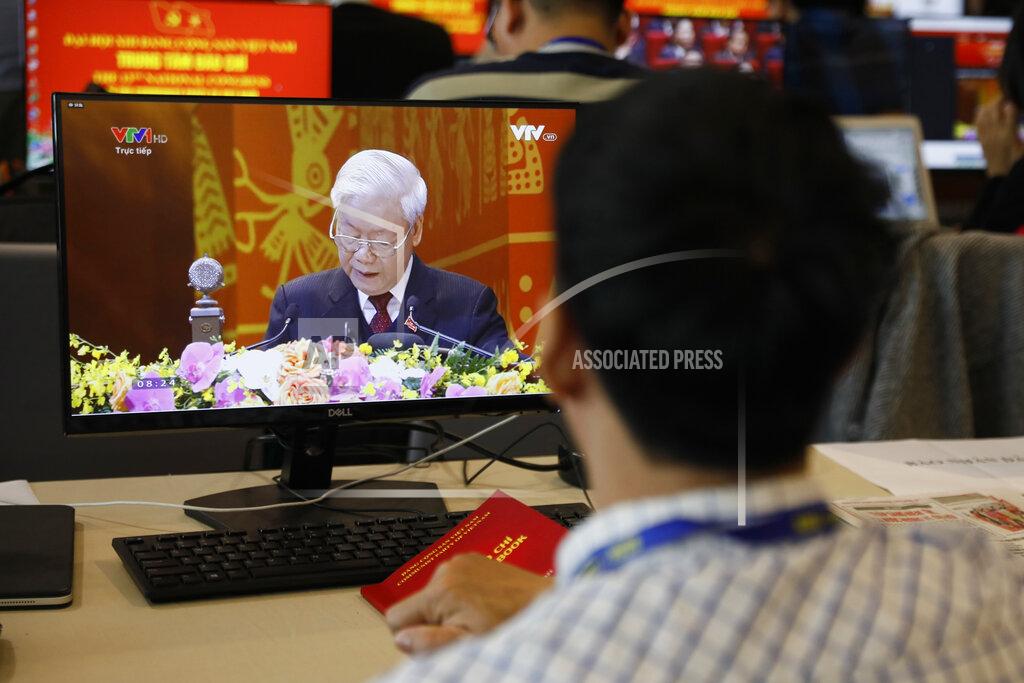 Minh Hoang A journalist sitting at the media center watches Nguyen Phu Trong, general secretary of the Communist Party of Vietnam delivering a speech, on screen, during the opening ceremony of the 13th National Congress of Vietnam's Communist Party (VCP), in Hanoi, Vietnam on Tuesday, Jan. 26, 2021. Vietnam's ruling Communist Party has begun a crucial weeklong meeting in the capital Hanoi to set the nation's path for the next five years and appoint the country's top leaders. (AP Photo/Minh Hoang)