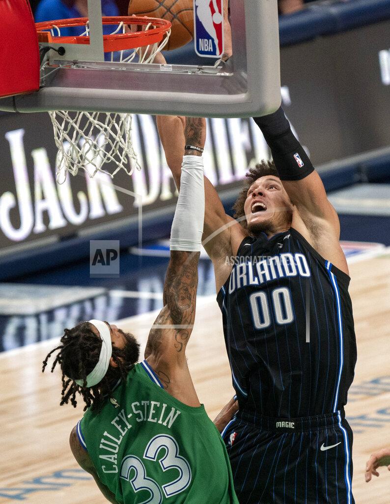 Jeffrey Mcwhorter Orlando Magic forward Aaron Gordon (00) tries to dunk over Dallas Mavericks center Willie Cauley-Stein (33) during the second half of an NBA basketball game, Saturday, Jan. 9, 2021, in Dallas. (AP Photo/Jeffrey McWhorter)
