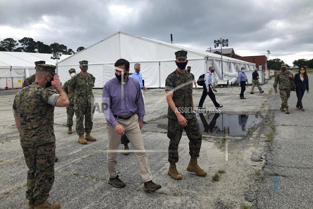 Lolita Baldor Marine Maj. Gen. James Glynn, on the right, gives Defense Secretary Mark Esper a tour of the temporary tent city that was put up to quarantine new recruits at the Marine Corps' Parris Island Recruit Depot, S.C., May 27, 2020. Recruits are now being housed at the Citadel, the Marine college in Charleston. Glynn is the Parris Island commander. In ways big and small, the virus is impacting training at the Marine Corps' Parris Island Recruit Depot and across the military. (AP Photo/Lolita Baldor)