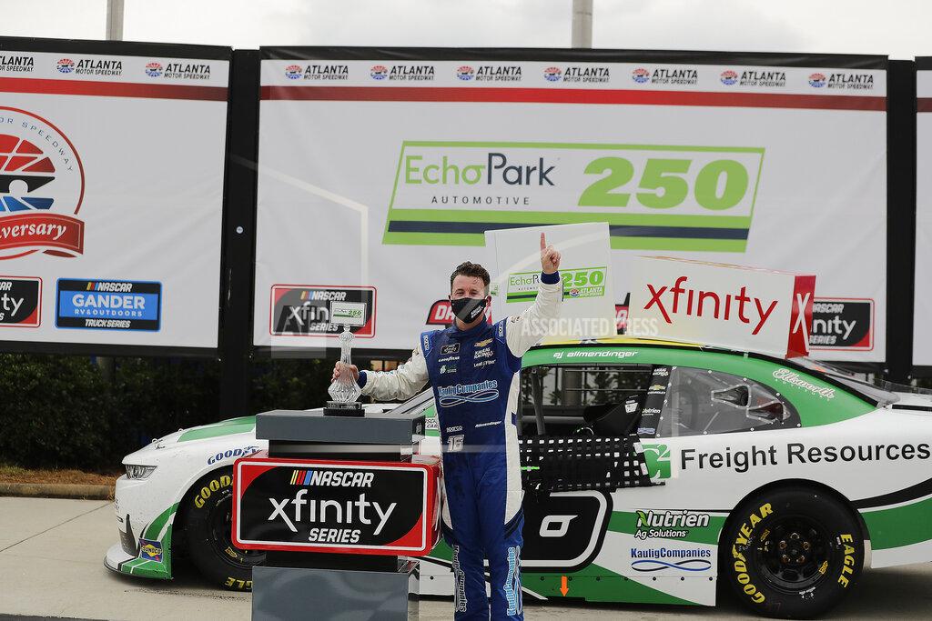 Brynn Anderson AJ Allmendinger celebrates after he won a NASCAR Xfinity Series auto race at Atlanta Motor Speedway, Saturday, June 6, 2020, in Hampton, Ga. (AP Photo/Brynn Anderson)