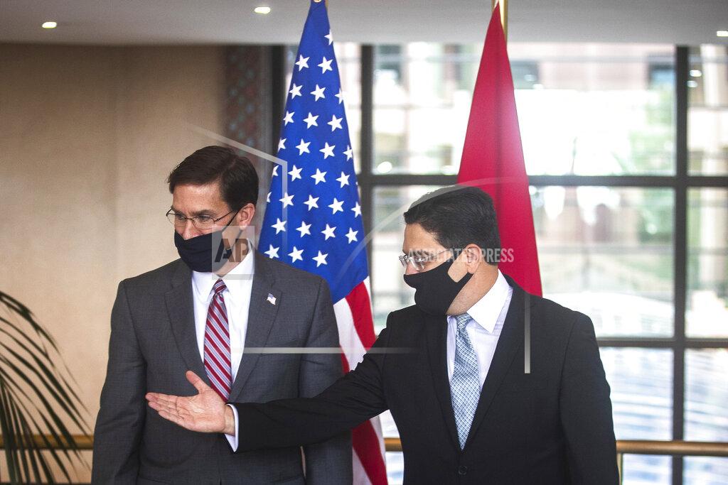 Mosa'ab Elshamy US Secretary of Defense Mark Esper, left, is received by Moroccan Foreign Minister Nasser Bourita, right, in Rabat, Morocco, Friday, Oct. 2, 2020. The visit is part of US Defense Secretary Mark Esper's North Africa tour and is his first visit to Africa as defense secretary. (AP Photo/Mosa'ab Elshamy)