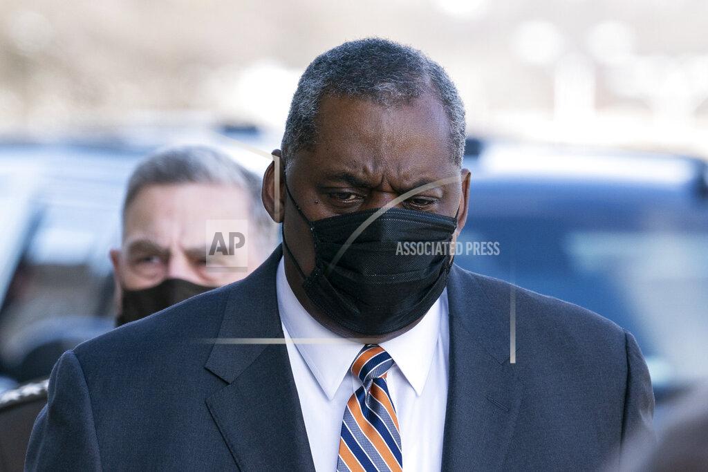 Alex Brandon Defense Secretary Lloyd Austin arrives at the Pentagon, followed by Joint Chiefs Chairman Gen. Mark Milley, Friday, Jan. 22, 2021, in Washington. (AP Photo/Alex Brandon)