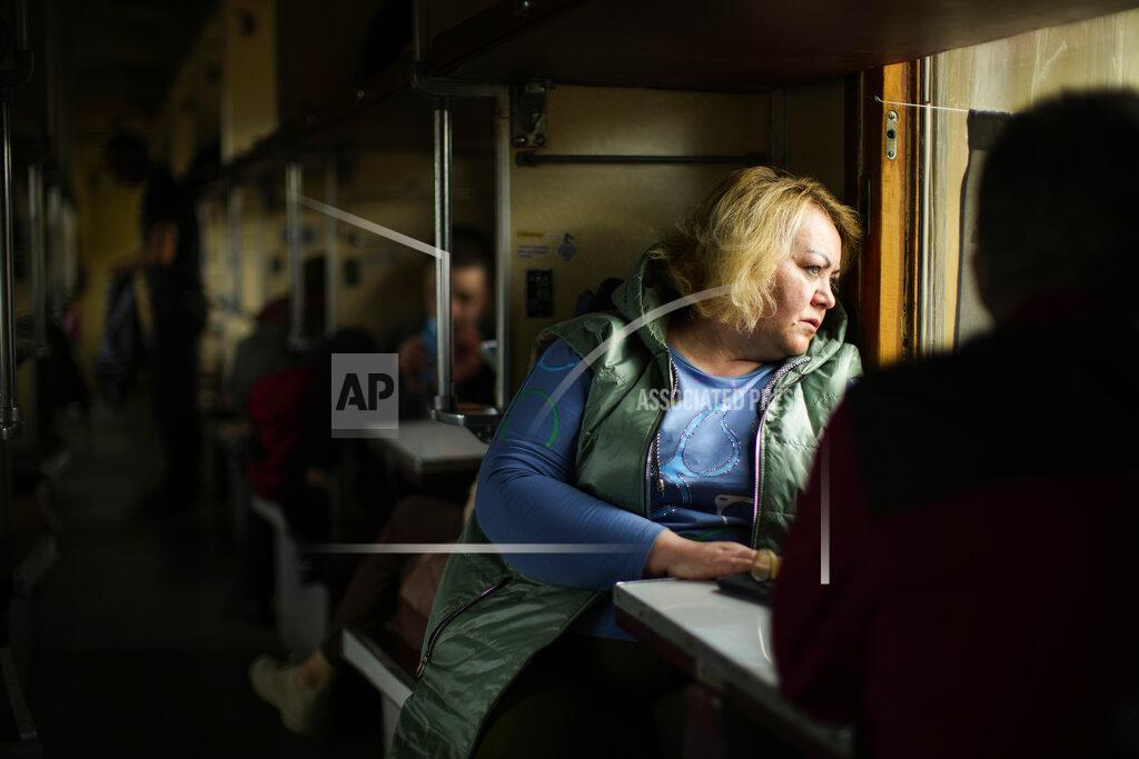 Francisco Seco People fleeing from heavy shelling board an evacuation train at Pokrovsk train station, in Pokrovsk, eastern Ukraine, Sunday, May 22, 2022. Civilians fleeing areas near the eastern front in the war in Ukraine Sunday described scenes of devastation as their towns and villages came under sustained attack from Russian forces. (AP Photo/Francisco Seco)