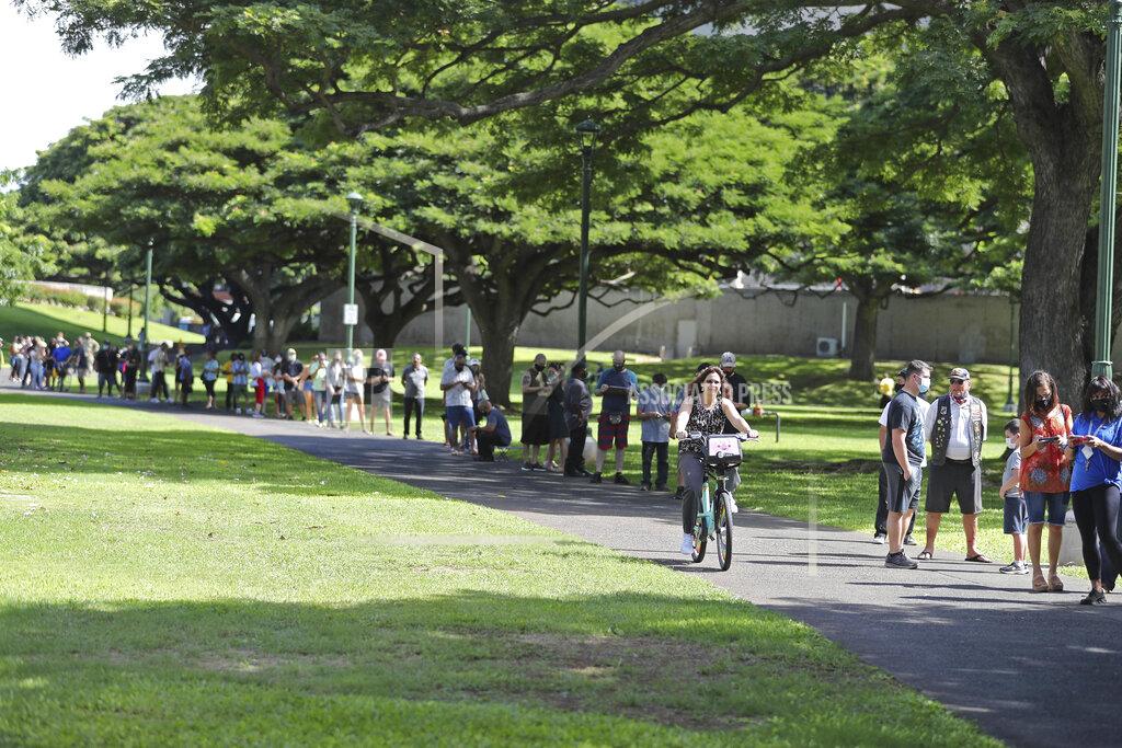 Marco Garcia A line of people waiting to vote stretches around City Hall on Election Day, Tuesday, Nov. 3, 2020, in Honolulu. (AP Photo/Marco Garcia)