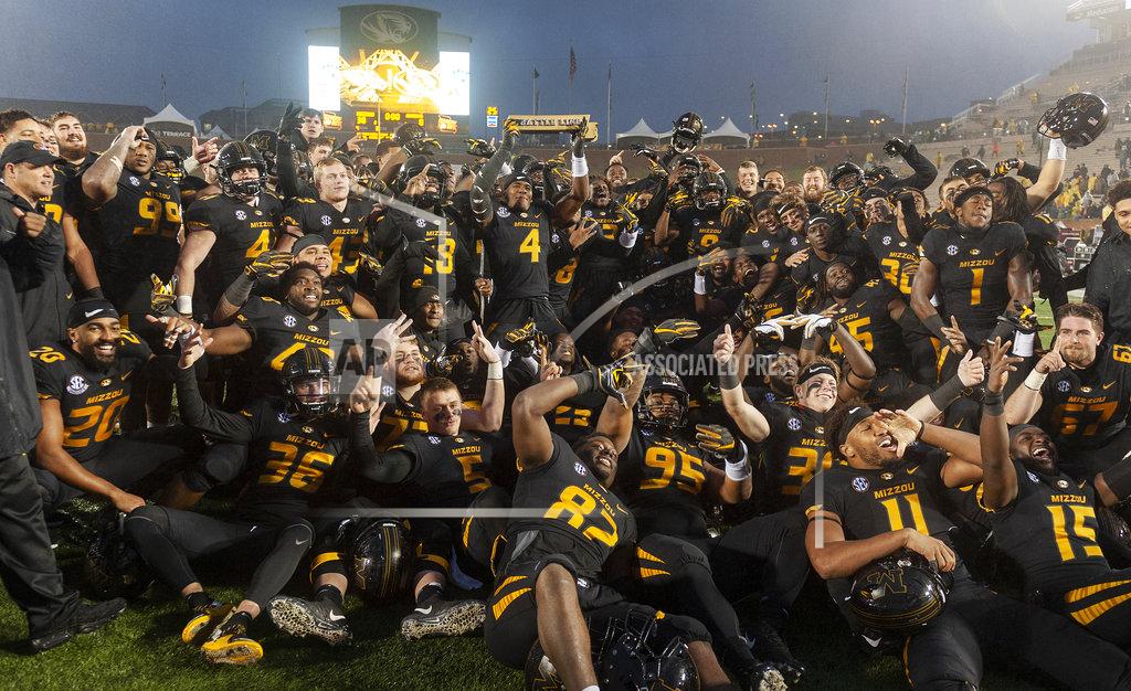 L.g. Patterson The Missouri football team poses with the Battle Line Rivalry trophy after a 38-0 win over Arkansas inan NCAA college football game Friday, Nov. 23, 2018, in Columbia, Mo. (AP Photo/L.G. Patterson)
