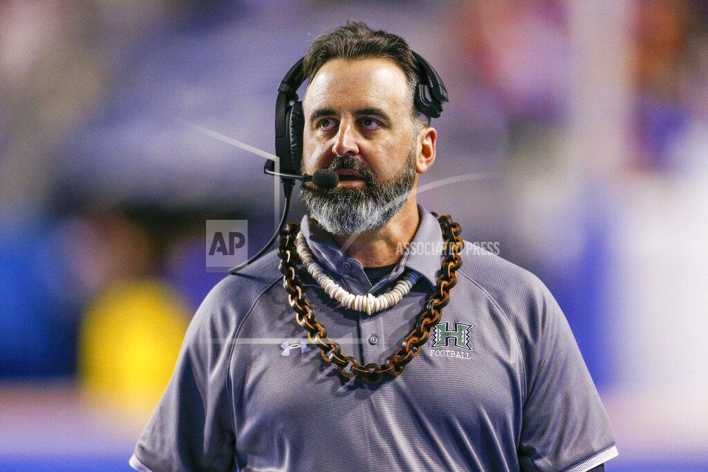 FILE - In this Saturday, Oct. 12, 2019, file photo, Hawaii head coach Nick Rolovich walks the sideline during the second half of an NCAA college football game against Boise State, in Boise, Idaho. Nick Rolovich dived right in when Washington State hired him in January. Just when it seemed like things were up and rolling, the COVID-19 pandemic hit. The national shutdown hurt coaches across college football as they prepare for the 2020-21 season, but it was particularly difficult on programs with first-year coaches trying to build something new from the ground up. (AP Photo/Steve Conner, File)