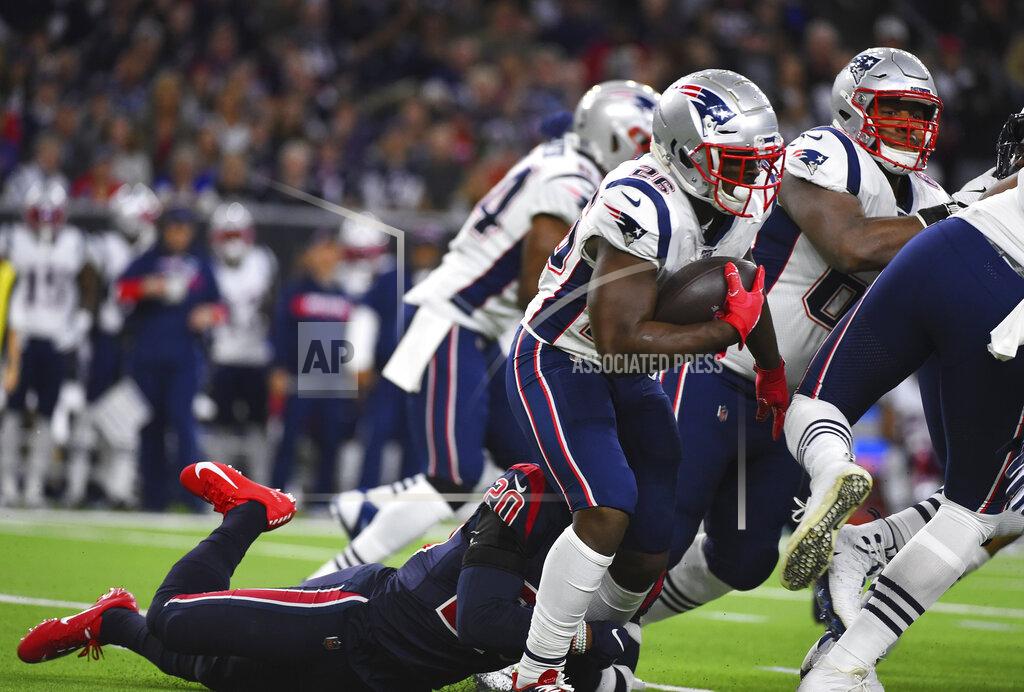 Eric Christian Smith New England Patriots running back Sony Michel (26) is hit by Houston Texans strong safety Justin Reid (20) on a run during the first half of an NFL football game Sunday, Dec. 1, 2019, in Houston. (AP Photo/Eric Christian Smith)