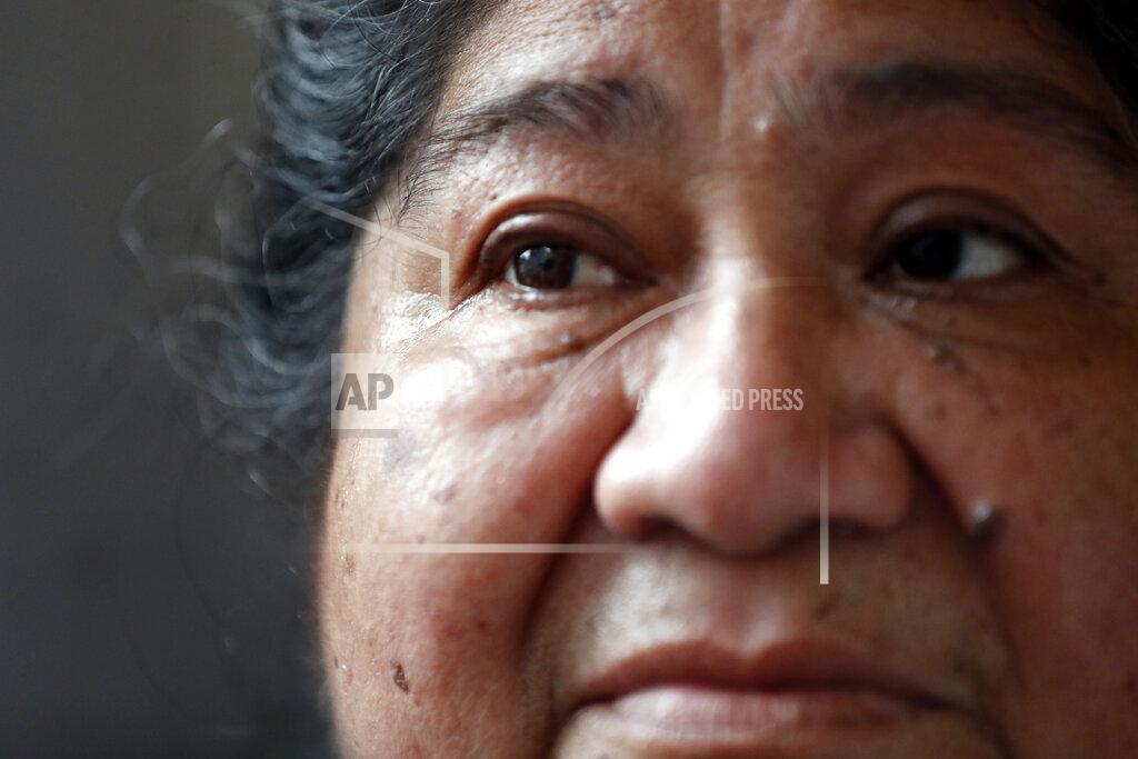 Shafkat Anowar Maria Elena Estamilla, 62, sheds tear while sharing her struggle of remaining without an insurance, Wednesday, June 30, 2021, at her house in Chicago's Pilsen neighborhood. Most mornings, Estamilla wakes up with pelvic pain and dread that she faces the same fate as her mother and grandmother: fatal cervical cancer. (AP Photo/Shafkat Anowar)