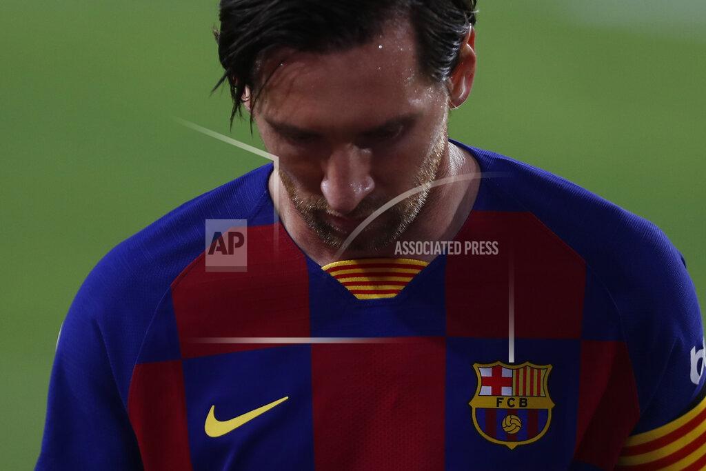 Angel Fernandez Barcelona's Lionel Messi looks down during the Spanish La Liga soccer match between Sevilla and FC Barcelona at the Ramon Sanchez-Pizjuan stadium in Seville, Spain, Friday, June 19, 2020. (AP Photo/Angel Fernandez)