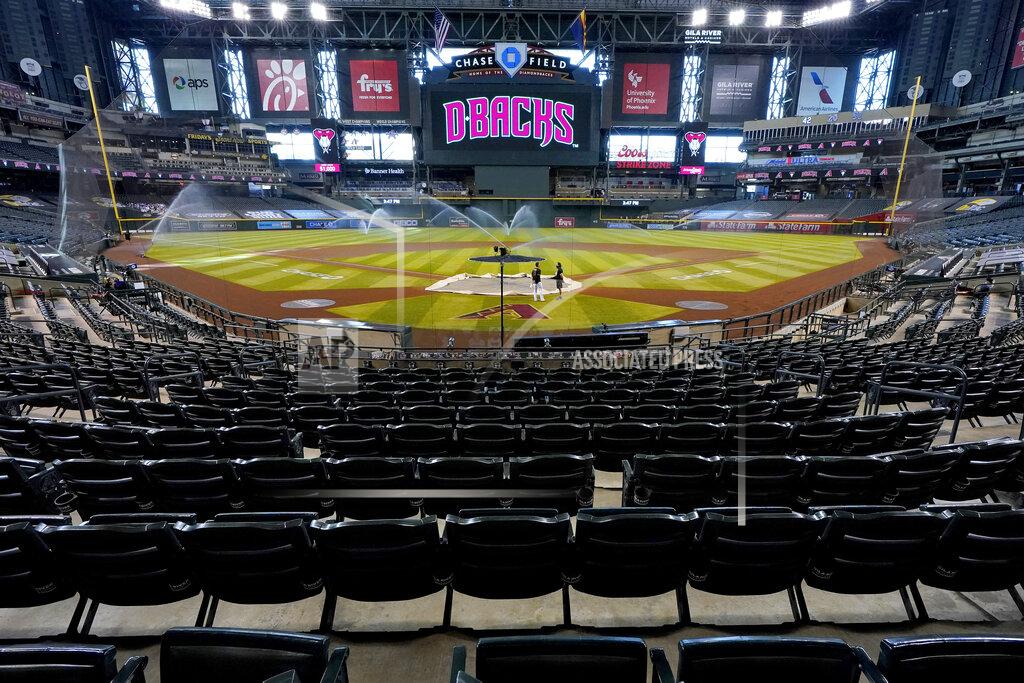 Matt York FILE - Chase Field sits empty after the Colorado Rockies decided not to play their baseball game against the Arizona Diamondbacks, on Aug. 27, 2020, in Phoenix. Arizona’s first sports betting operations are set to open in time for the start of the NFL season with live wagers allowed on college and professional sports. Betting will be allowed starting Thursday, Sept. 9, 2021, online and at the FanDuel Sportsbook at the downtown Phoenix arena where the Phoenix Suns play and at temporary betting windows at the Arizona Diamondbacks’ Chase Field. (AP Photo/Matt York, File)