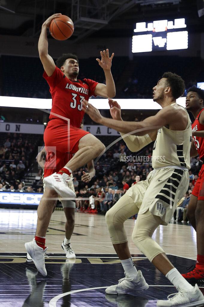 Chuck Burton Louisville's Jordan Nwora (33) goes up to the basket as Wake Forest's Olivier Sarr defends during the first half of an NCAA college basketball game in Winston-Salem, N.C., Wednesday, Jan. 30, 2019. (AP Photo/Chuck Burton)